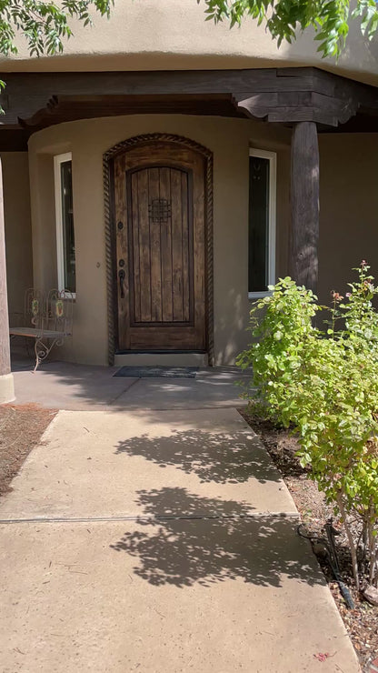 video of harvest hunks decorating a porch with their concierge pumpkin delivery service in Albuquerque, New Mexico